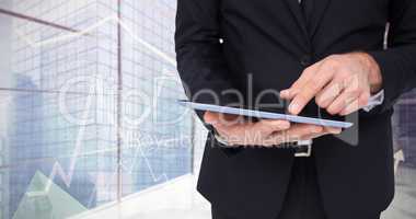 Composite image of mid section of a businessman touching digital