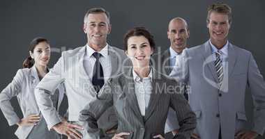 Composite image of business colleagues standing in a row