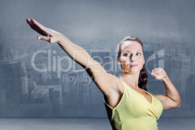 Composite image of beautiful confident athlete stretching hands