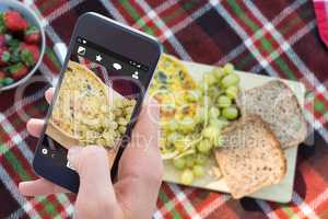 Composite image of woman using her mobile phone