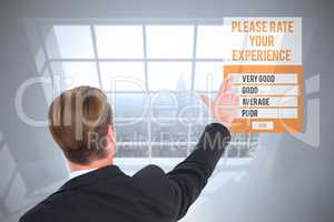 Composite image of rear view of businessman pointing with his fi