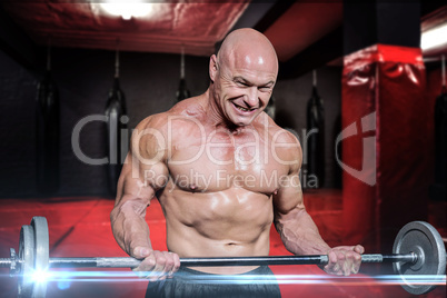 Composite image of passionate healthy man exercising while lifti