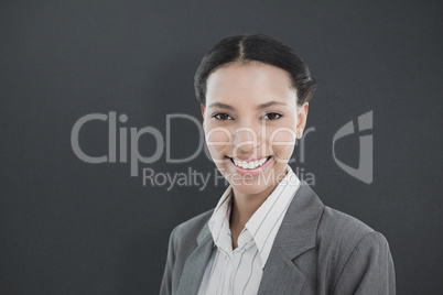 Composite image of businesswoman with colleagues behind in offic