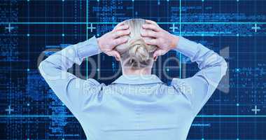 Composite image of rear view of worried businesswoman holding he
