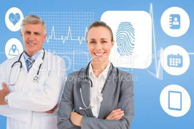 Composite image of smiling doctors with arms crossed