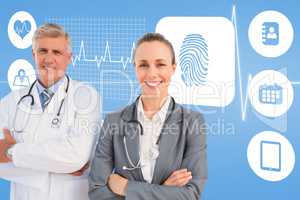 Composite image of smiling doctors with arms crossed