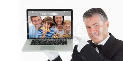 Composite image of smiling waiter pointing us something on a lap