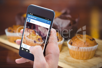 Composite image of woman using her mobile phone