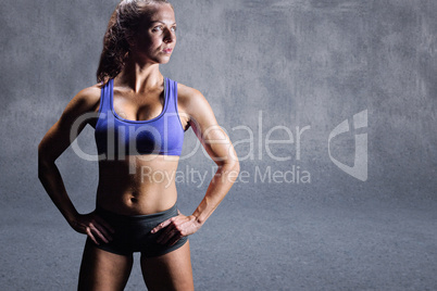 Composite image of confident bodybuilder with hand on hip