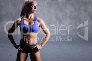 Composite image of confident bodybuilder with hand on hip