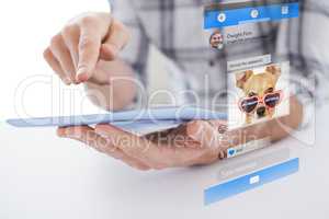 Composite image of casual man using tablet pc