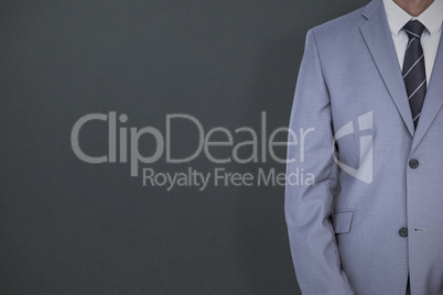 Composite image of businessman with badge