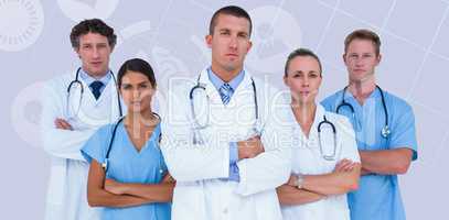Composite image of portrait of serious doctors standing with arm