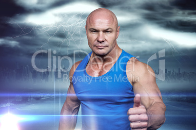 Composite image of portrait of confident muscular man showing th