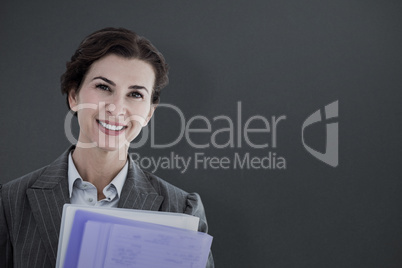 Composite image of portrait of beautiful businesswoman with file