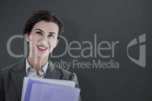 Composite image of portrait of beautiful businesswoman with file