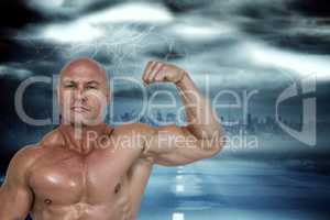 Composite image of portrait of muscular man flexing bicep