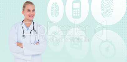 Composite image of smiling female doctor standing arms crossed