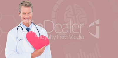 Composite image of smiling male doctor holding heart shape card