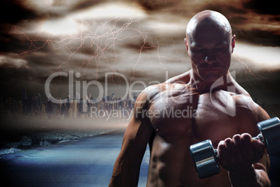 Composite image of concentrated bodybuilder lifting dumbbell