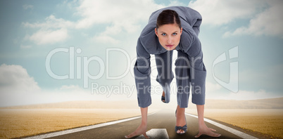 Composite image of tradeswoman in sprinting position