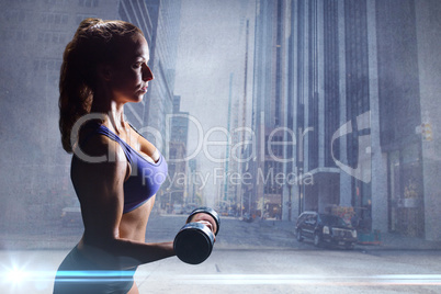 Composite image of side view of sexy woman lifting dumbbell