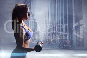 Composite image of side view of sexy woman lifting dumbbell