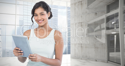 Composite image of portrait of smiling businesswoman using table