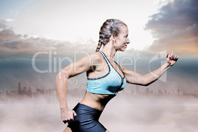 Composite image of side view of female athlete running