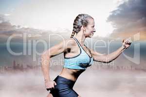 Composite image of side view of female athlete running