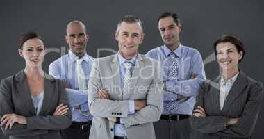 Composite image of business team working happily together on lap