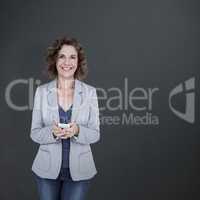 Composite image of portrait of smiling businesswoman using mobil