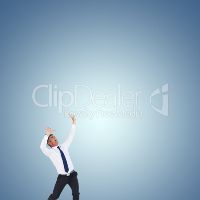 Composite image of businessman with hands raised on white backgr