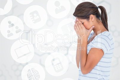 Composite image of side view of upset woman covering face