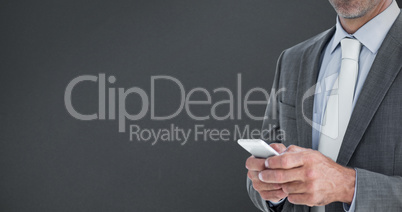 Composite image of portrait of confident businessman text messag