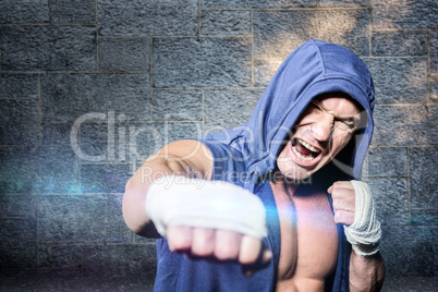 Composite image of aggressive fighter punching against black bac