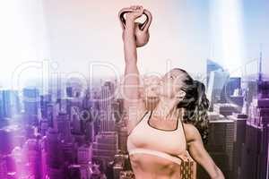 Composite image of woman lifting kettlebell