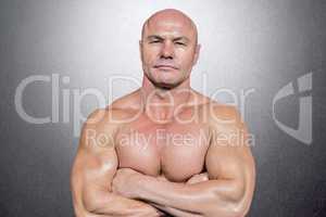 Composite image of portrait of man with arms crossed