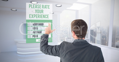 Composite image of businessman pointing with his fingers