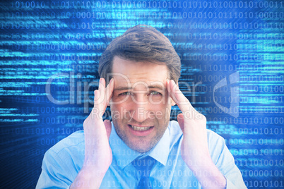 Composite image of young businessman with severe headache