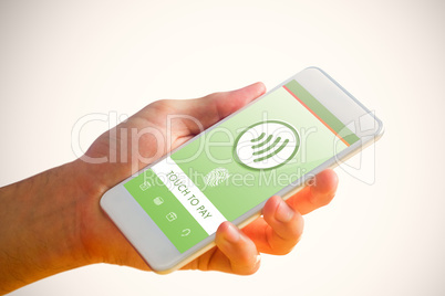 Composite image of hand holding smartphone