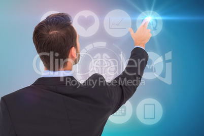 Composite image of businessman in suit  pointing these fingers