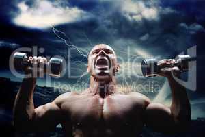 Composite image of aggressive bodybuilder lifting bumbbells