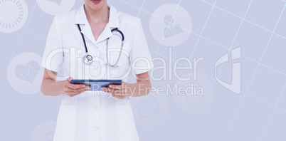 Composite image of midsection of female doctor using tablet comp
