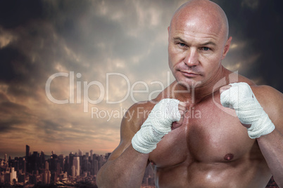Composite image of portrait of man with fighting stance