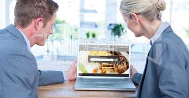Composite image of business people looking at blank screen of la