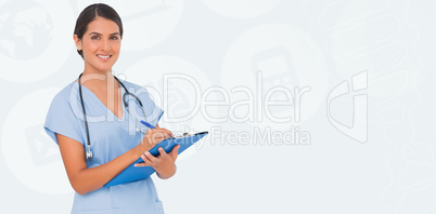 Composite image of smiling nurse writing