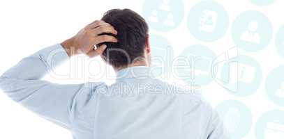 Composite image of businessman scratching his head