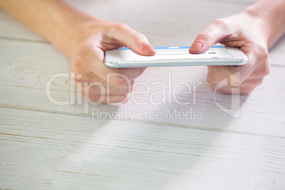 Composite image of woman using smartphone