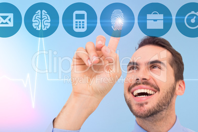 Composite image of happy businessman pointing something up